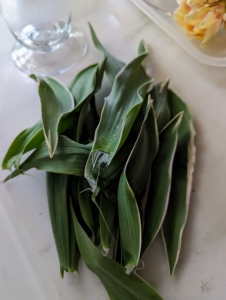 Any leaves that would sit below the waterline should be removed to keep the flowers fresh and prevent bacteria from growing.
