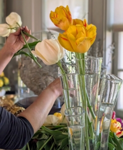 My antique glass finger vases work well for tulips because they support the tall stems.