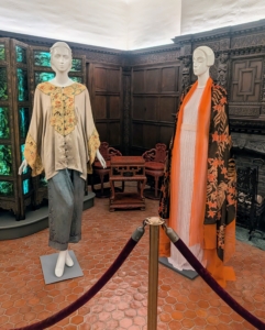 Displayed here - a two piece ensemble used for lounging and a light tiger-lily patterned shawl.