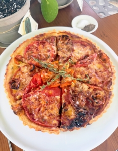 I like to serve the tomato tart warm to hot. Here is one of several. Not one piece was left over.