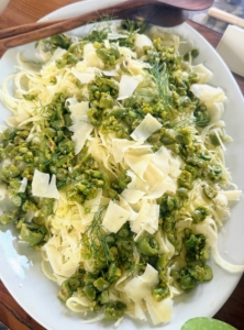 The fennel salad is served with strips of provolone cheese, olives and herbs.
