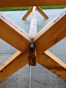 The top peg on the trestle is made of walnut, a very strong and stable wood that can take intricate carving.