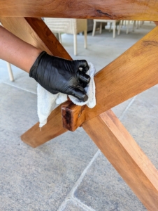She also makes sure to gets into the corners and crevices, removing any accumulated dust while restoring its shine.