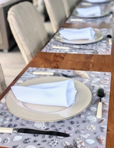 Flatware is placed next. When hosting a meal, be sure to decide what utensils, plates, and platters will be needed ahead of time, so there is no last minute rush.