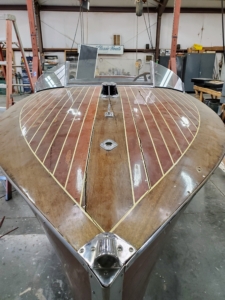 THRILL was entrusted to Greg Rudloff of Northwest Classic Boats where it was lovingly restored to its original beauty. Here is the boat in August 2024 before work began.