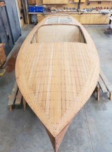 Restoring and replanking THRILL was a very labor‑intensive process that involved removing old planks, inspecting the hull frame, and installing new ones that match the original curves and joinery of the boat.