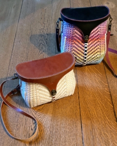 Gabriel Frey is a Passamaquoddy artist and 12th-generation black ash basketmaker whose work has earned national recognition. He made these two more modern basket handbags with leather tops.