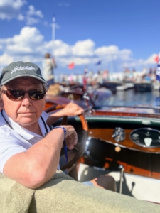 THRILL's first launch was at the 2026 Lake Tahoe Concours d'Elegance Show. It was so exciting for Judy and her son to see it back in the water. Here's Preston ready to start the engine. Out of a group of 60, THRILL was the second oldest boat entered at 98 years. THRILL won a second place trophy for the category "pre-war runabout over 23' in length."