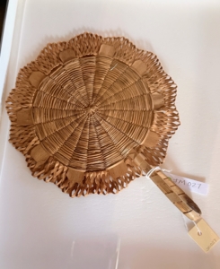 This is a hand fan from the 1800s handmade from black ash.