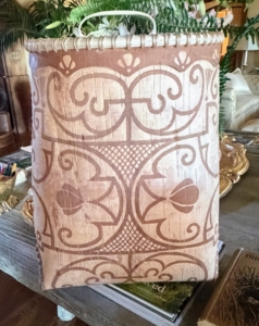 This is a fine example showing Gabriel's birchbark etching. Here, Gabriel etches the darker bark and scrapes out the white double curved designs. These are traditional designs used by the Wakanabi Nation citizens to create more modern pieces.