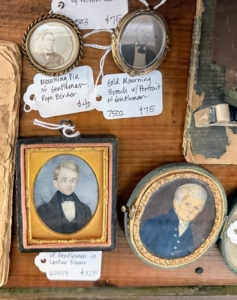 These are considered "smalls" or small and often charming vintage or antique items. These "smalls" are mourning brooches - commemorative pieces worn to honor and remember a deceased loved one.