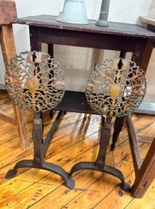 Do you have andirons in your fireplace? Andirons are metal supports, usually used in pairs to hold firewood raised and in place, allowing air circulation and preventing logs from rolling out.