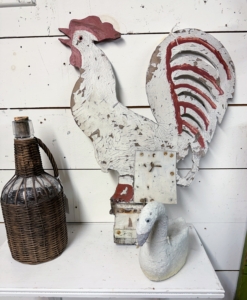 Many of the pieces are decorative. This is a vintage wooden rooster.