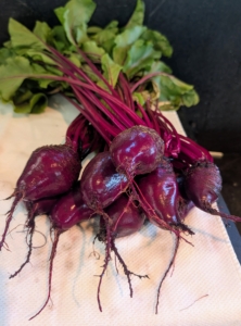 She carefully cleans the beets one by one.