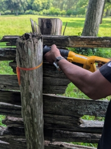 Pete also removes the nails connecting the post to the railings.