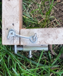 The frame is secured with latches and hooks to ensure it is perfectly square.