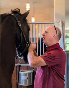 Next, Brian visits Ulysses, the younger horse. Brian has been practicing for more than 35-years. He always works in the horse stalls where they are most relaxed.