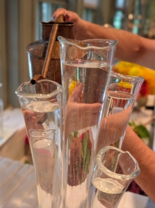Fill the vase with cool water, but always leave a little room, so water doesn't overflow. Vases need enough to keep stems submerged so they can draw water efficiently, without deteriorating.