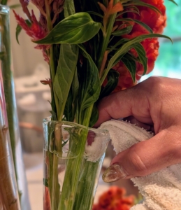 If some water needs to be removed, use a small towel inserted into the vase to absorb the excess fluid. This is a good tip especially when vases are already full with flowers.