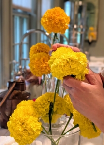 Enma loves these fragrant Aztec marigolds. Also known as American marigold or African marigold, Aztec marigold, Tagetes erecta, is a showy, easy-to-grow annual that blooms from summer to the first frost. The huge blooms appear on top of one to four-foot stems and come in shades of orange, yellow, bronze, and creamy white.