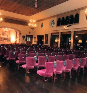 This is the Music Room at Caramoor. This room seats 170 guests and is known for its Renaissance furniture, Gothic tapestries, and beautifully maintained stained glass elements.