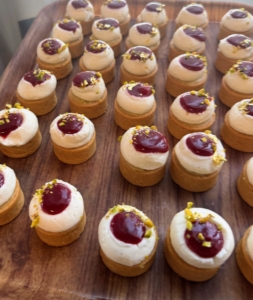 These flavorful tarts are made with frangipane raspberry jam, pistachio pastry cream and vanilla crémeux.