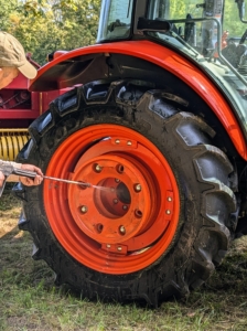 And look at the wheels – each one is five feet in diameter. Chhiring makes sure the tractor and all its tires are also well cleaned.