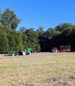 As one makes windrows, the other pulls the baler up and down the field.