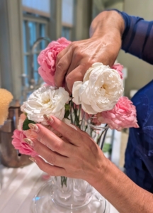 Enma chooses one of my glass finger vases for the next arrangement. I love these vessels – they fit lots of stems and can be arranged to look very full.
