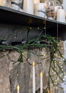 Dressing up the fireplace mantel can be so fun at Halloween with my six foot Illuminated Moss Garland. It can also be used on a dining room table as part of the centerpiece decorations.