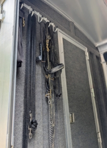 In the front cabin, there are ample hooks for all the bridles, girths, and harnesses.