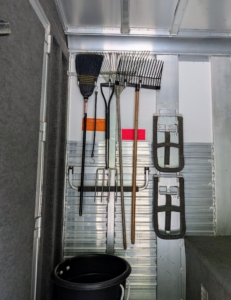 There are also hooks for rakes, muck shovels, and brooms.