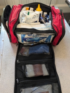 A well-stocked horse first aid kit should include wound care, bandaging materials, medications, monitoring tools, and practical equipment to stabilize injuries. It is important to check any first aid kit periodically to ensure supplies are up to date and in good condition.
