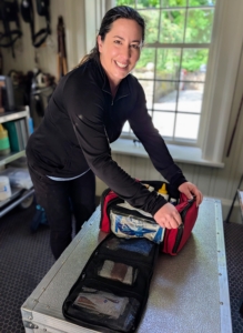 Next, Helen checks the first aid supplies. First aid kits tailored for horses are available at most horse supply companies and online.