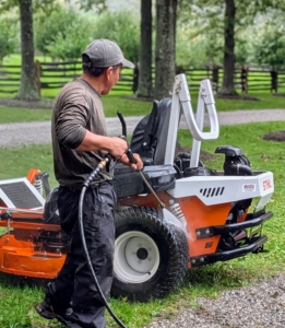 Out back, Phurba also power washes each of the mowers and makes sure each piece of equipment is in perfect working order.