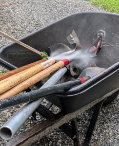 Next, any dirty garden tools are washed.