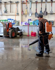 Here, Phurba uses the STIHL battery-operated blower to direct the water to the drains.