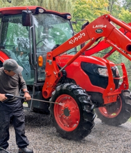 He also gives our Kubota tractor a good rinse. Regularly washing tractors is essential for safety, equipment longevity, and operational efficiency.