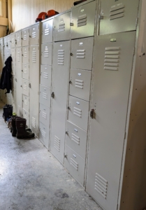 In another corner, we have this bank of lockers for the crew. Everyone has their own locker where they can store safety equipment, extra shoes, clothing, and other personal items.