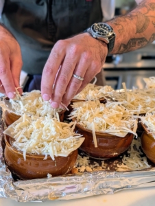 He also uses three different cheeses - Gruyère, Emmental, and Compte.