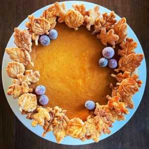A beautifully decorated pumpkin pie. A good tip - never waste those scraps of dough. Use small cookie cutter shapes to make decorations for the top of the pie.