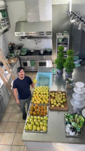 And here's Bernie in his kitchen with fresh picked pears they grew in their garden.
