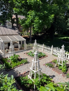 Here is Kemp's vegetable garden. He created it from a plain patch of grass. The plan was to make it both functional and decorative. The obelisks also served as tomato cages.