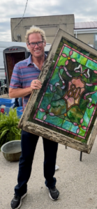 Jeremy also learned about flea markets from my shows and the flea market season is always his favorite because one never knows what collection one will start or what one will add to an existing collection. Here's Jeremy one spring when he picked up this wonderful 1880s stained glass window.