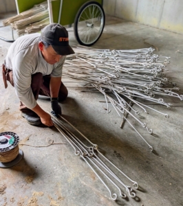 In my Equipment Barn, Phurba Sherpa organizes and ties stakes used every summer to support my herbaceous peonies. I designed these myself and had them made specifically for my garden.
