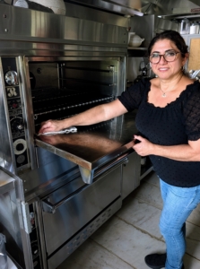 At the end of the day, Enma wipes down the ovens in my kitchen. Doing this regularly saves time and effort later.