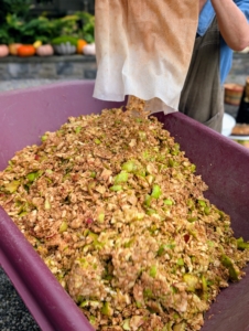 All the compressed apple pulp is emptied into a bin and set aside for my chickens – they love pecking at the scraps.