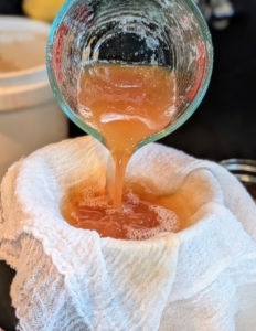 I add a step, which is to strain the cider through layers of damp cheesecloth. This removes all the foam.