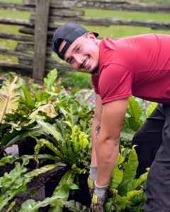 Some plants need repotting before going indoors. Matthew oversees what plants need to be moved into bigger containers.