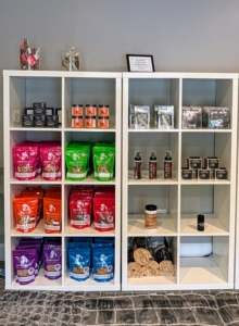 Other shelves include a curated collection of grooming accessories and supplies.